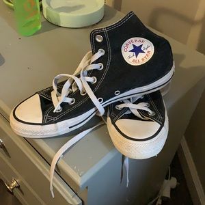 Black high-top converse sneakers